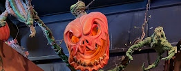 Grinning jack-o'-lantern with scarecrow