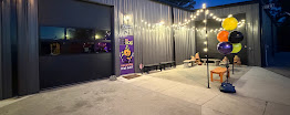 Exterior entrance with festive lights and balloons