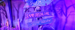 Spooky signposts to Salem, Camp Crystal Lake, and Sleepy Hollow